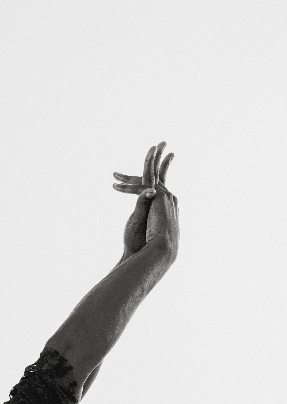 grayscale photo of persons hand