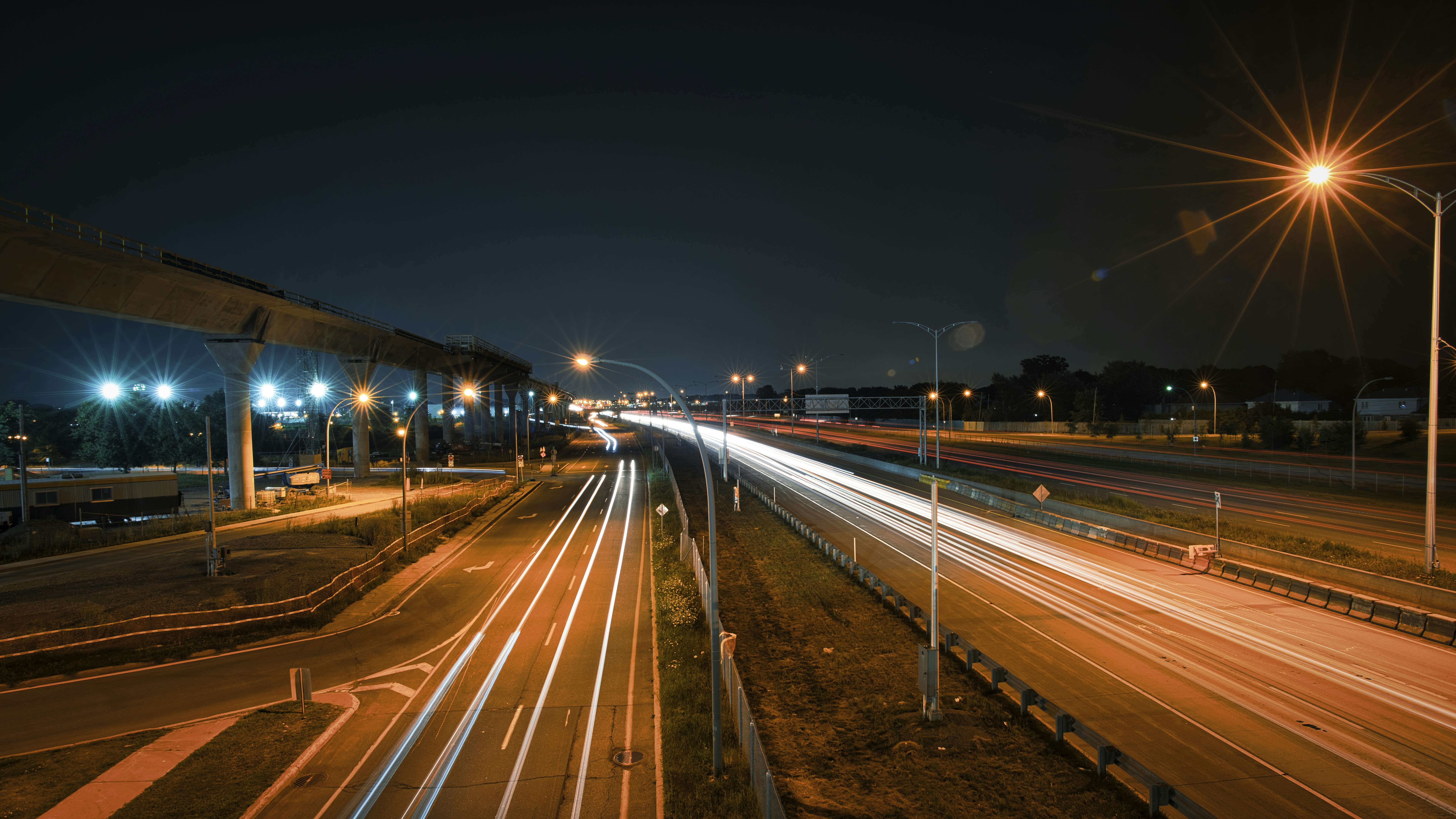 time lapse photography of cars on road during night time