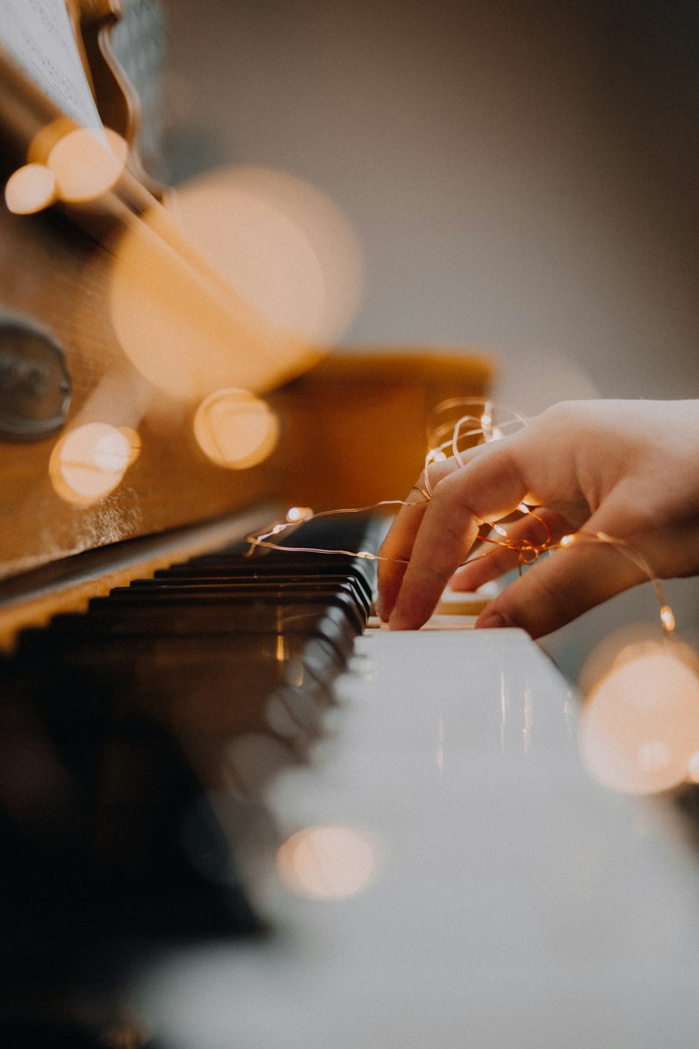 person playing piano in close up photography