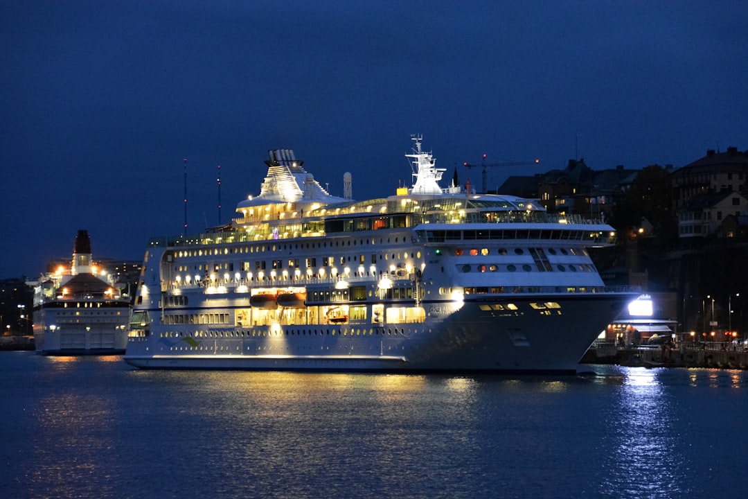 white and black cruise ship on sea during night time