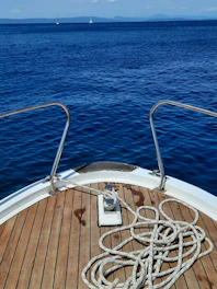 white and brown boat on blue sea during daytime