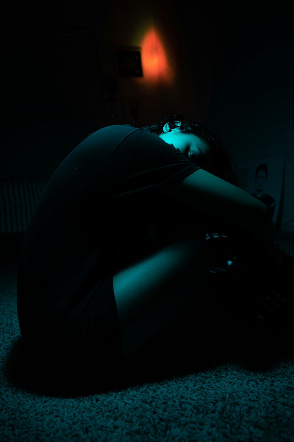 woman in black dress sitting on floor