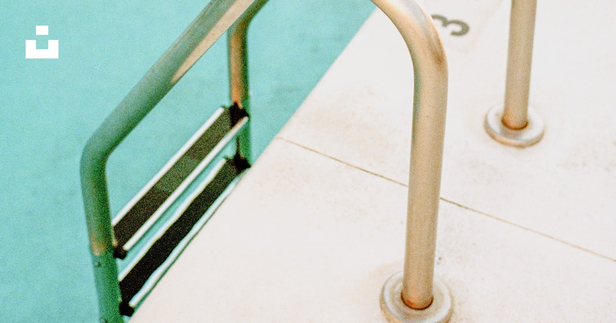 White metal railings near body of water during daytime photo – Free ...