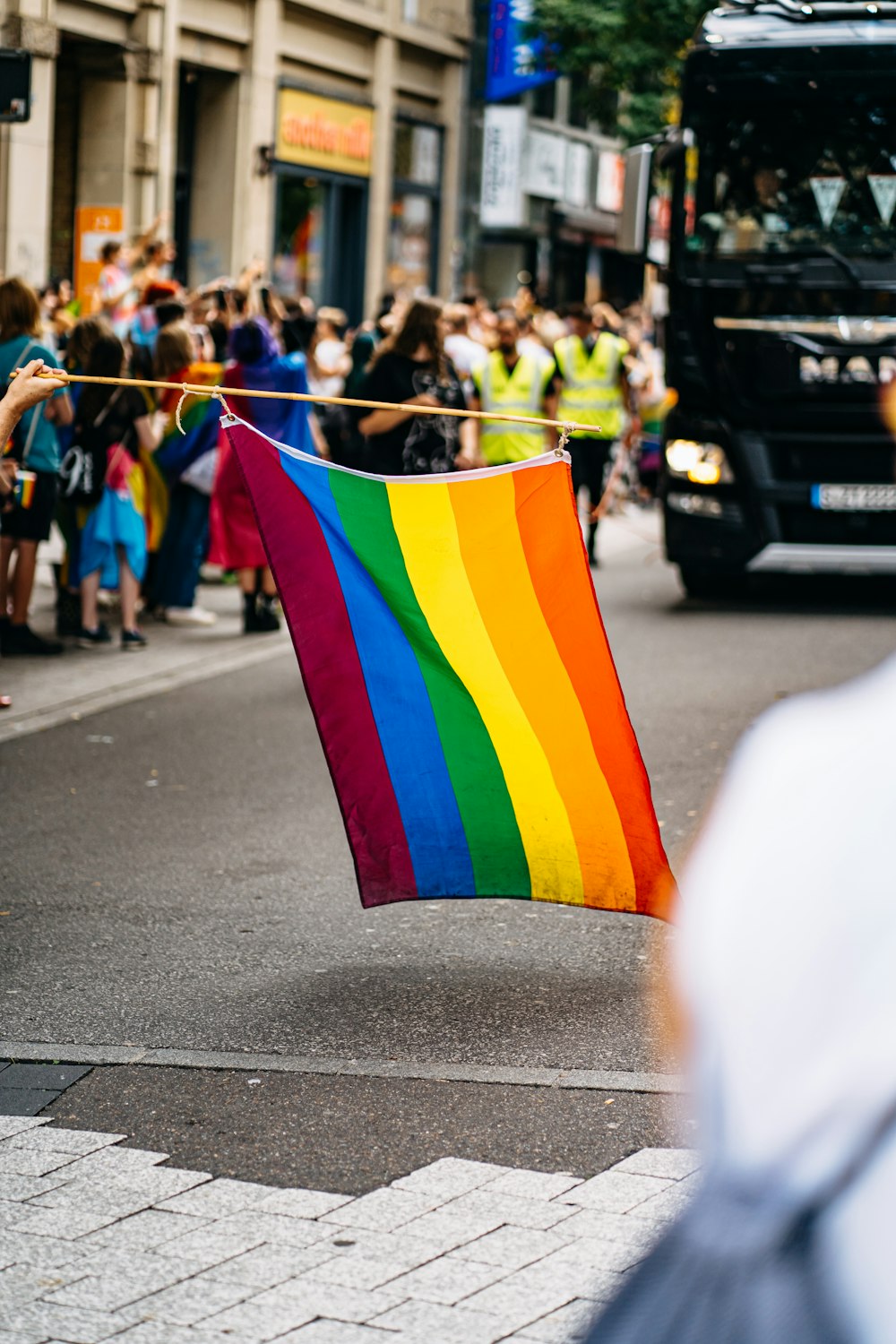 people holding flags during daytime