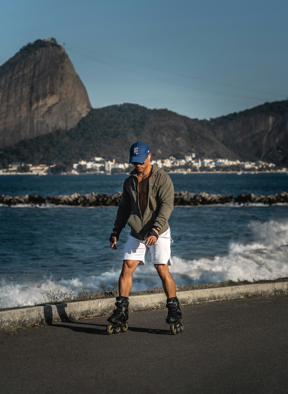 man in brown jacket and white shorts running on beach during daytime