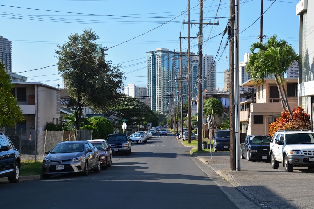 cars parked on side of the road during daytime