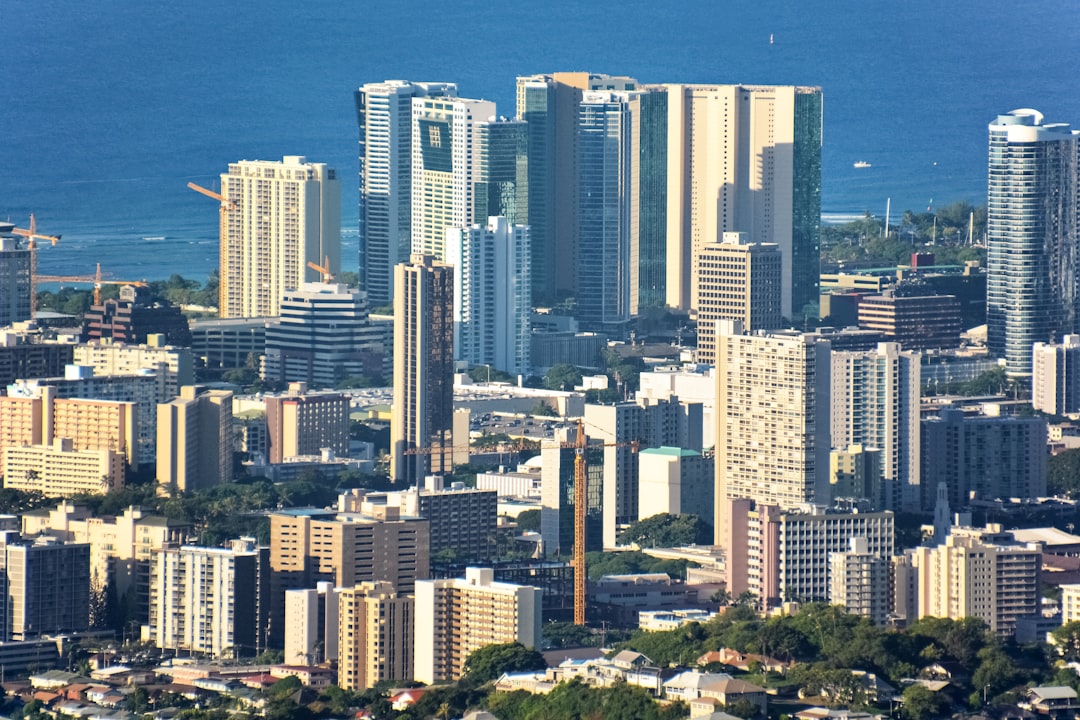 high rise buildings near body of water during daytime