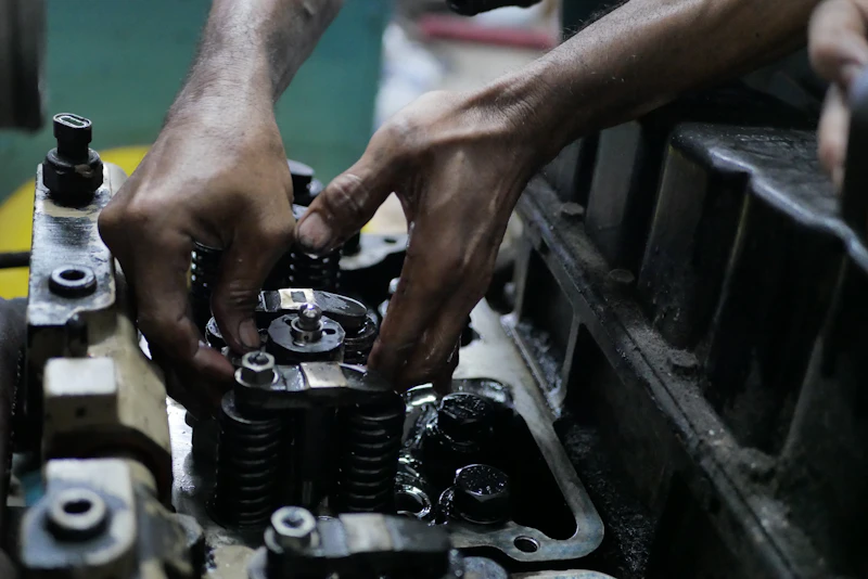 Mechanic holding a metal tool