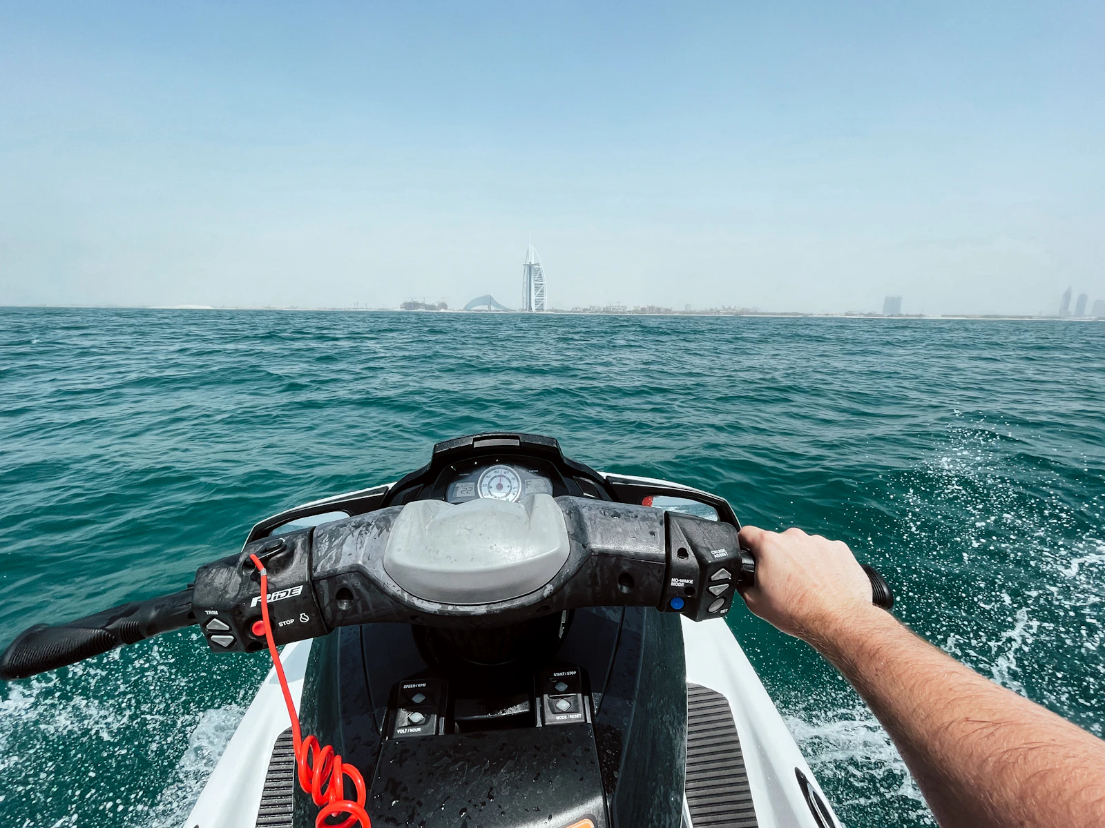 Rider's view from a jet ski on the Gulf, with Burj Al Arab on the horizon