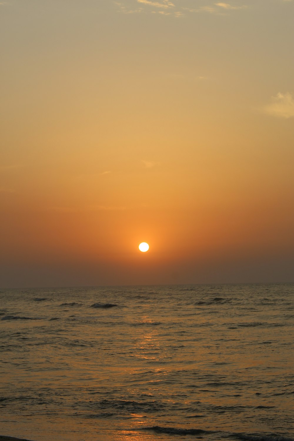 body of water during sunset