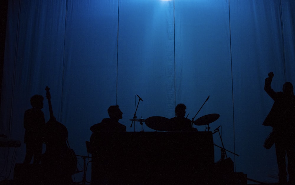 silhouette of people sitting on chair