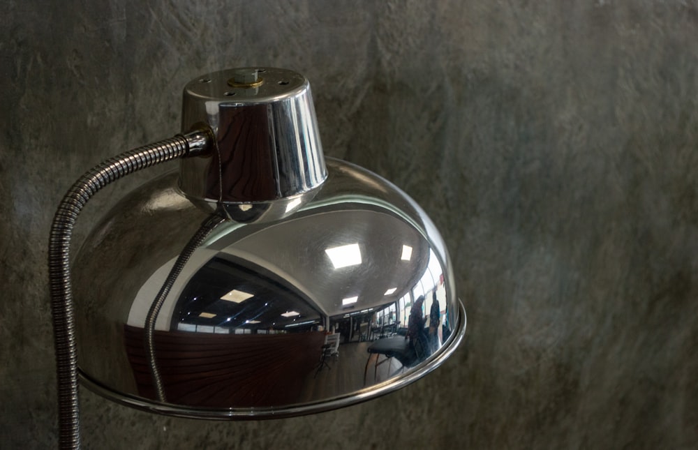 stainless steel and brown table lamp