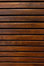 A beautifully finished wooden bed frame showcasing natural grain and smooth edges.