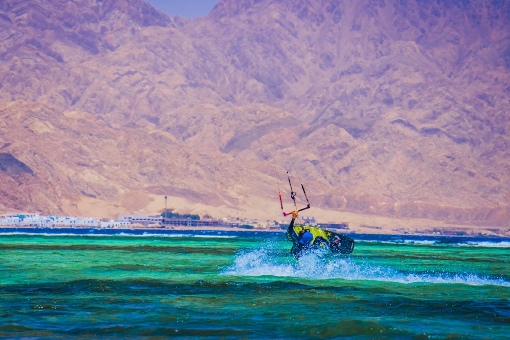 man surfing on sea during daytime