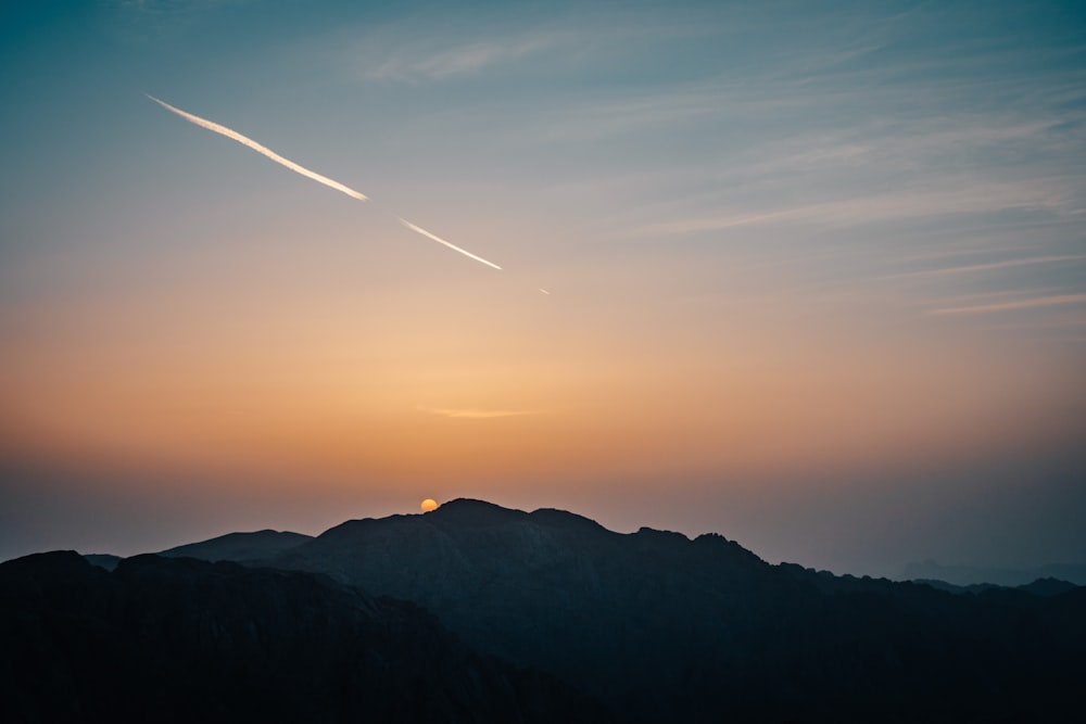 silhouette of mountains during sunset