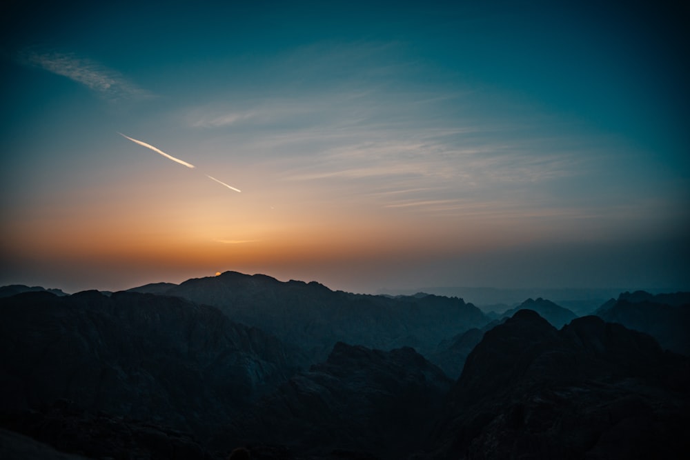 silhouette of mountains during sunset