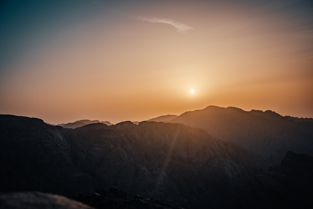 silhouette of mountains during sunset