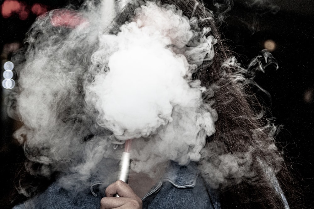 person holding white cotton candy