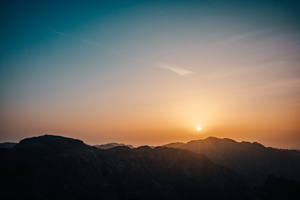 silhouette of mountains during sunset