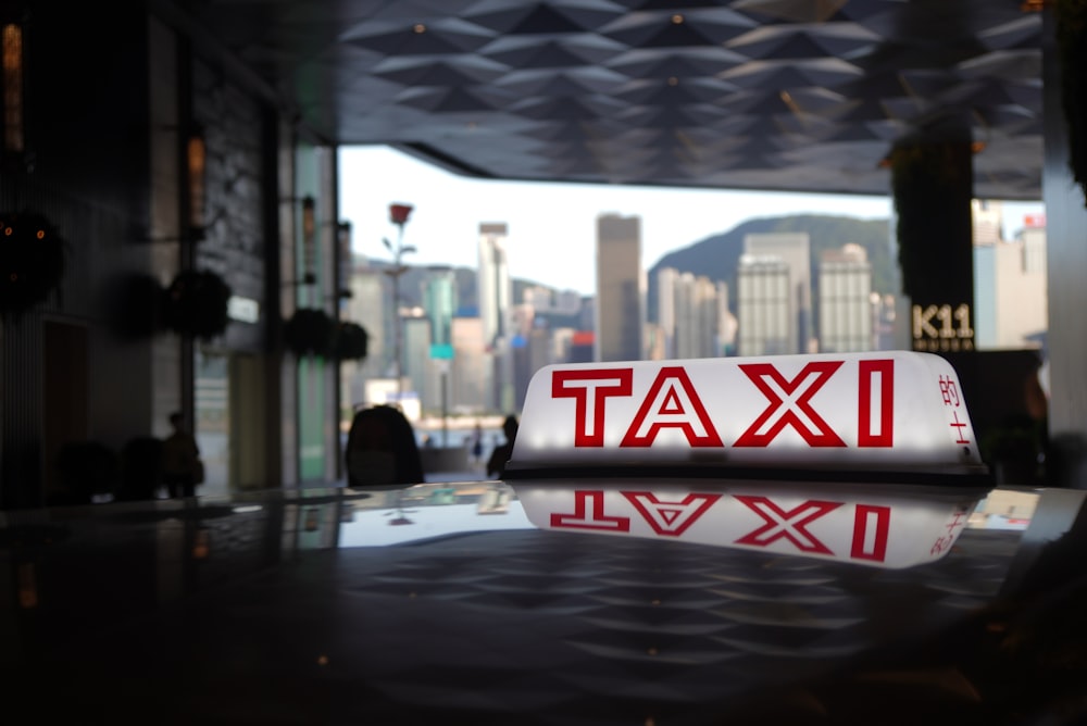 a close up of a taxi sign on a table