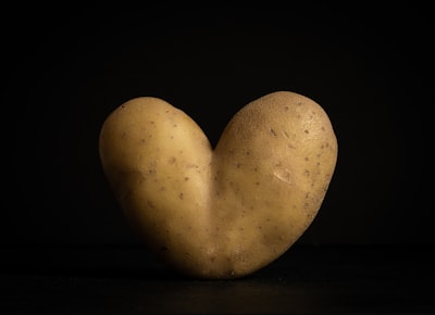 two heart shaped gray stones potato zoom background