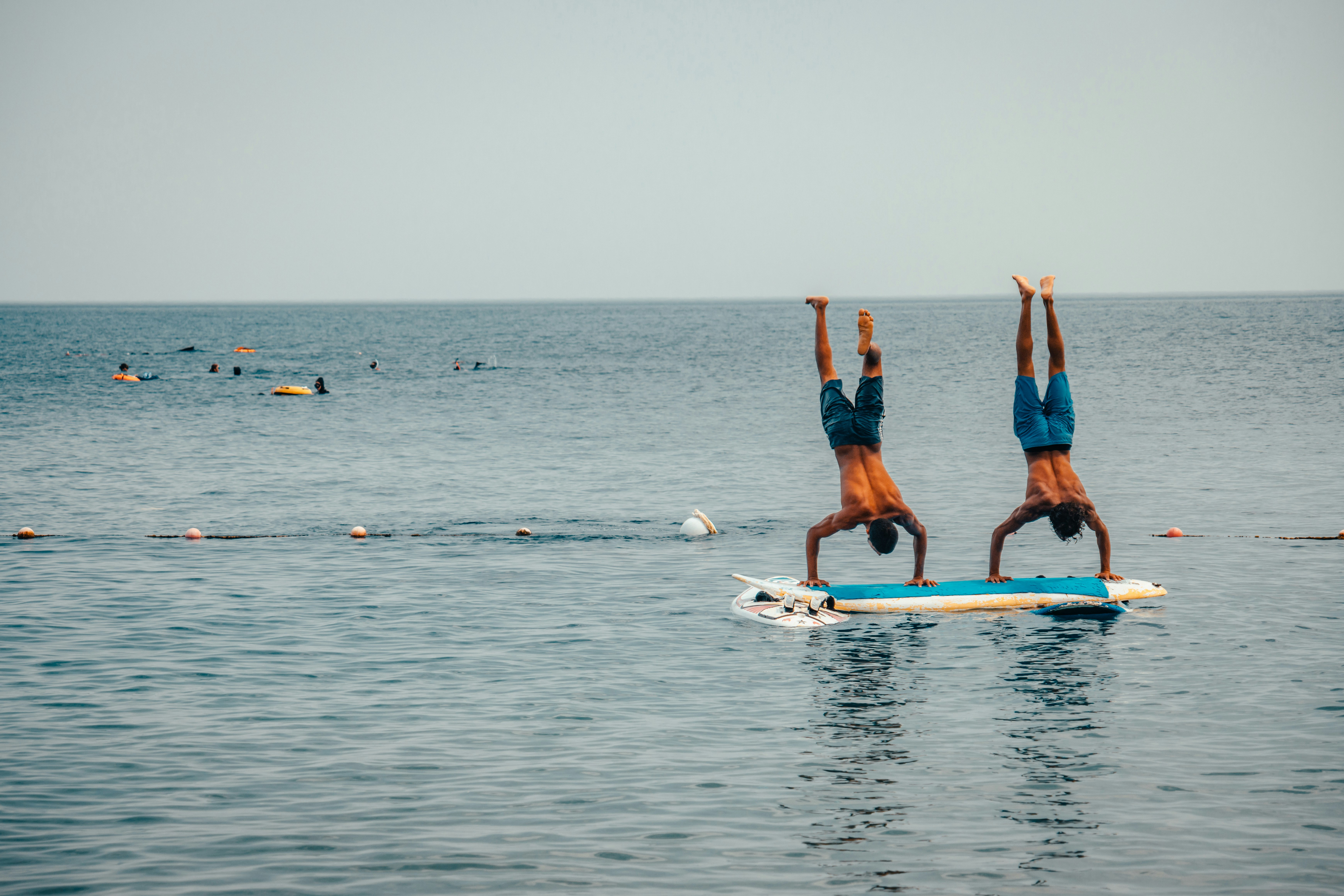 SUP yoga class in Dana Point Harbor with participants on paddleboards - dana point jet ski and kayak rental