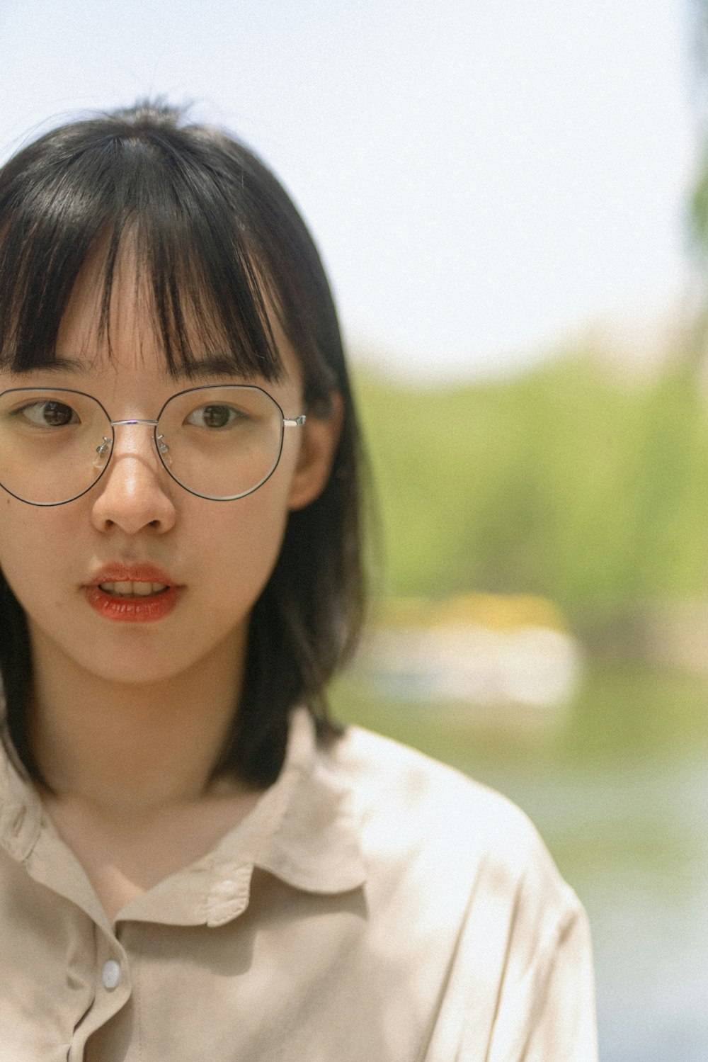 girl in white collared shirt wearing eyeglasses