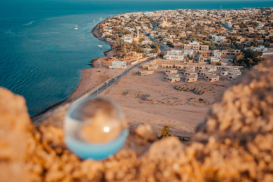 aerial view of city near body of water during daytime