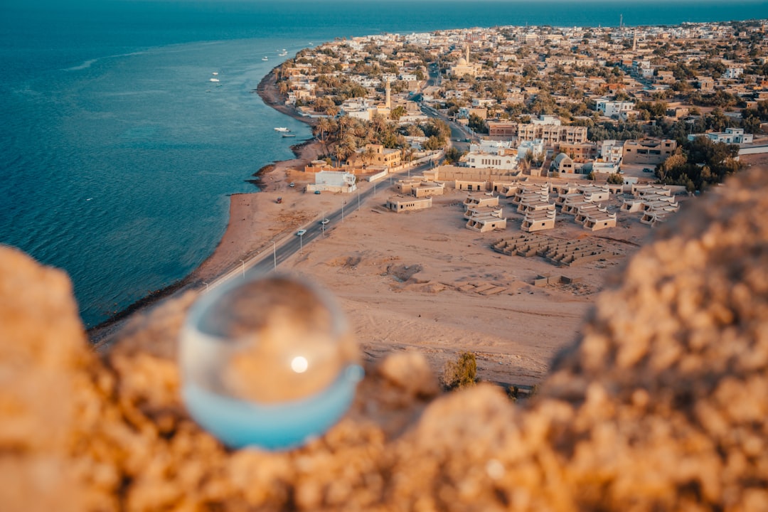 aerial view of city near body of water during daytime