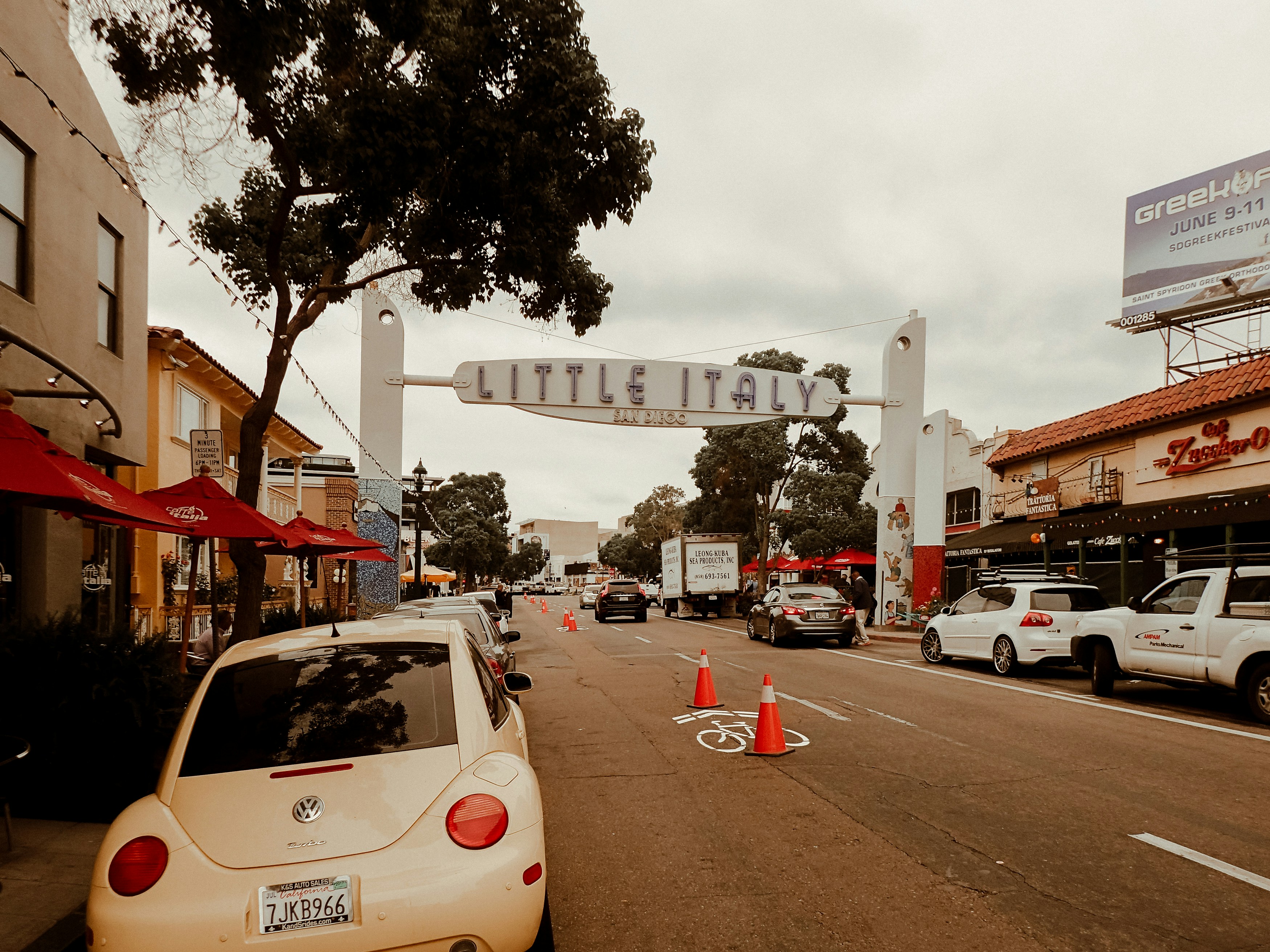 cars parked on the side of the road during daytime, Little Italy San Diego