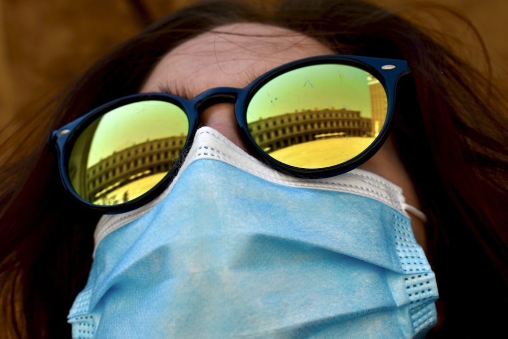 person wearing black framed sunglasses