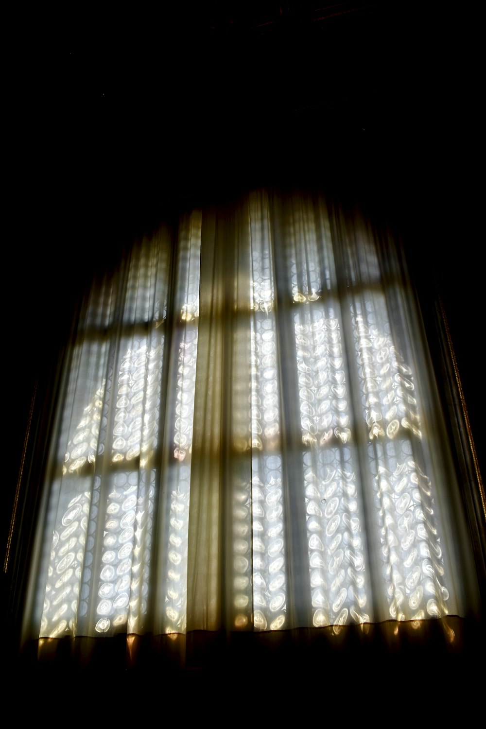 white and brown window curtain