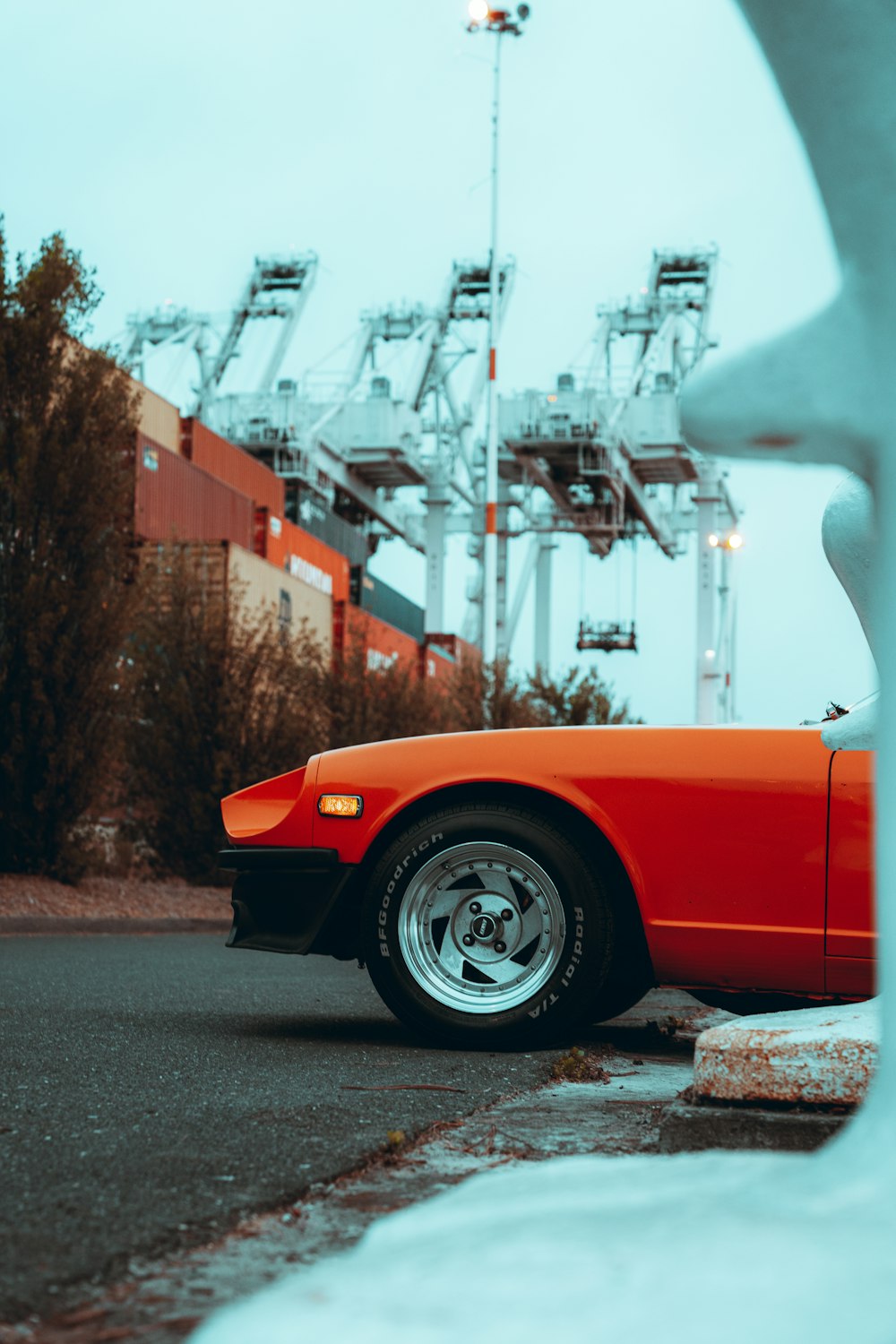 orange car on road during daytime