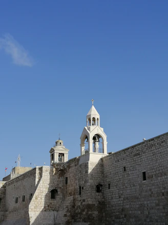 white concrete building under blue sky during daytime