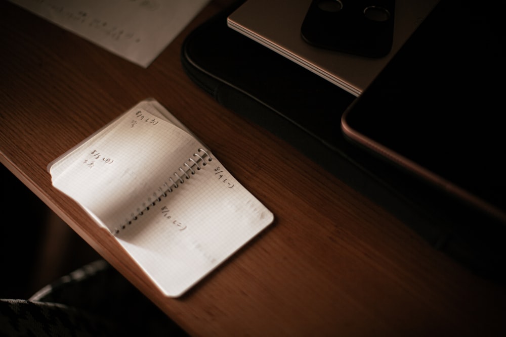 white paper document on brown wooden table