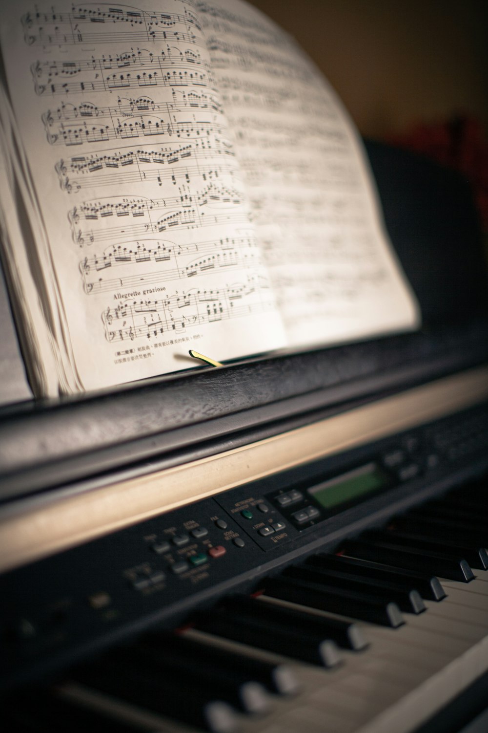 white musical notes on black piano