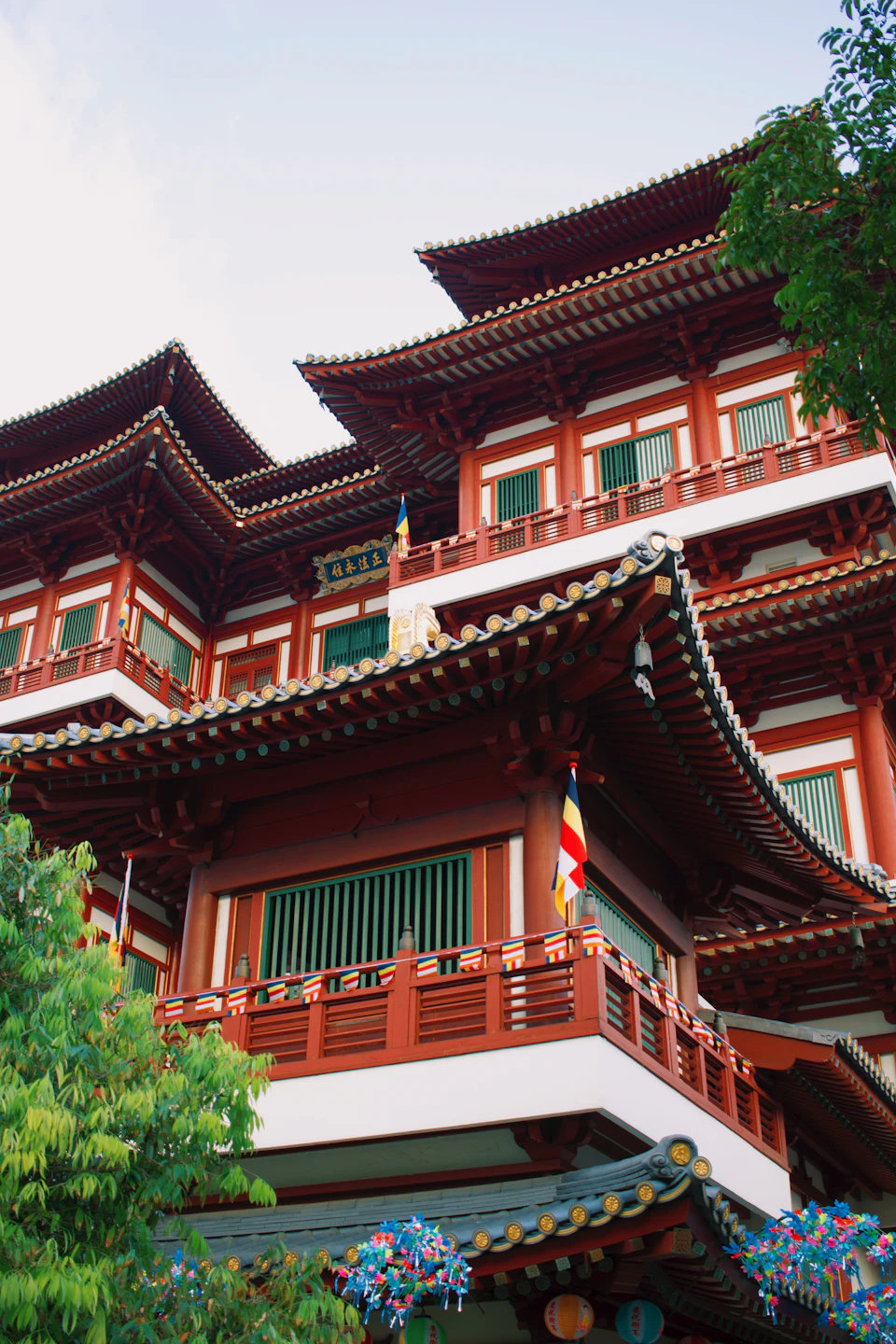 Red and gold facade of the Buddha Tooth Relic Temple in Singapore's Chinatown, the central venue for Vesak Day ceremonies