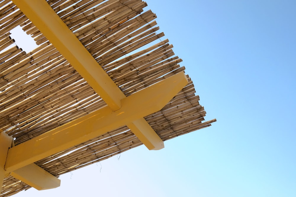 brown wooden roof under blue sky during daytime