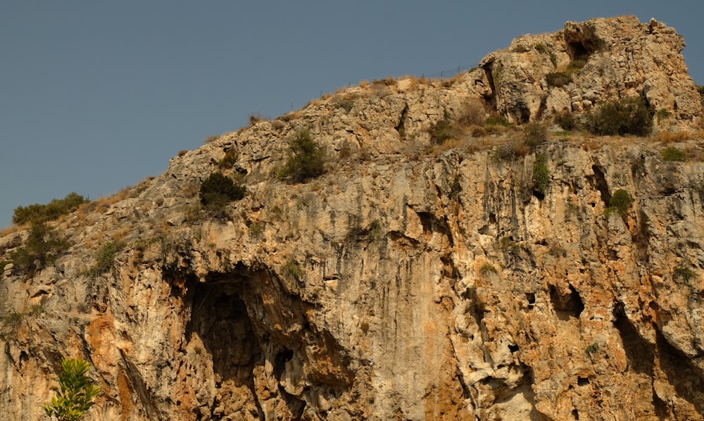 brown rocky mountain under blue sky during daytime