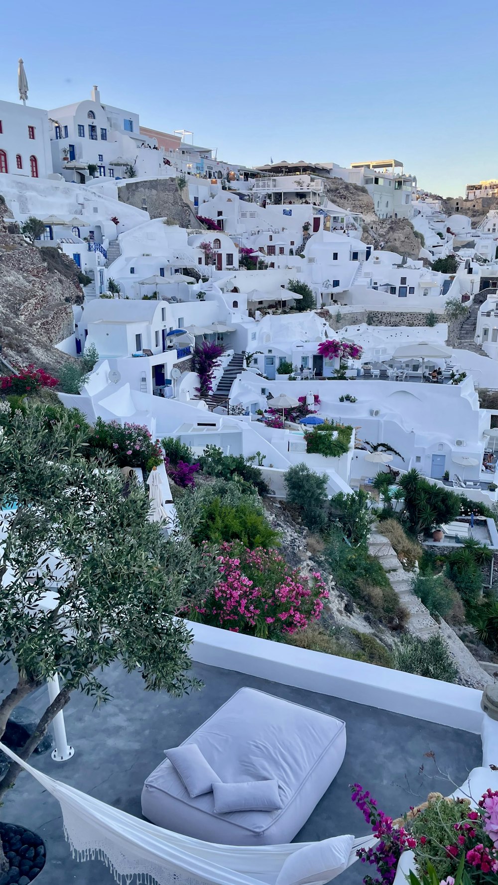 white concrete houses near green trees during daytime