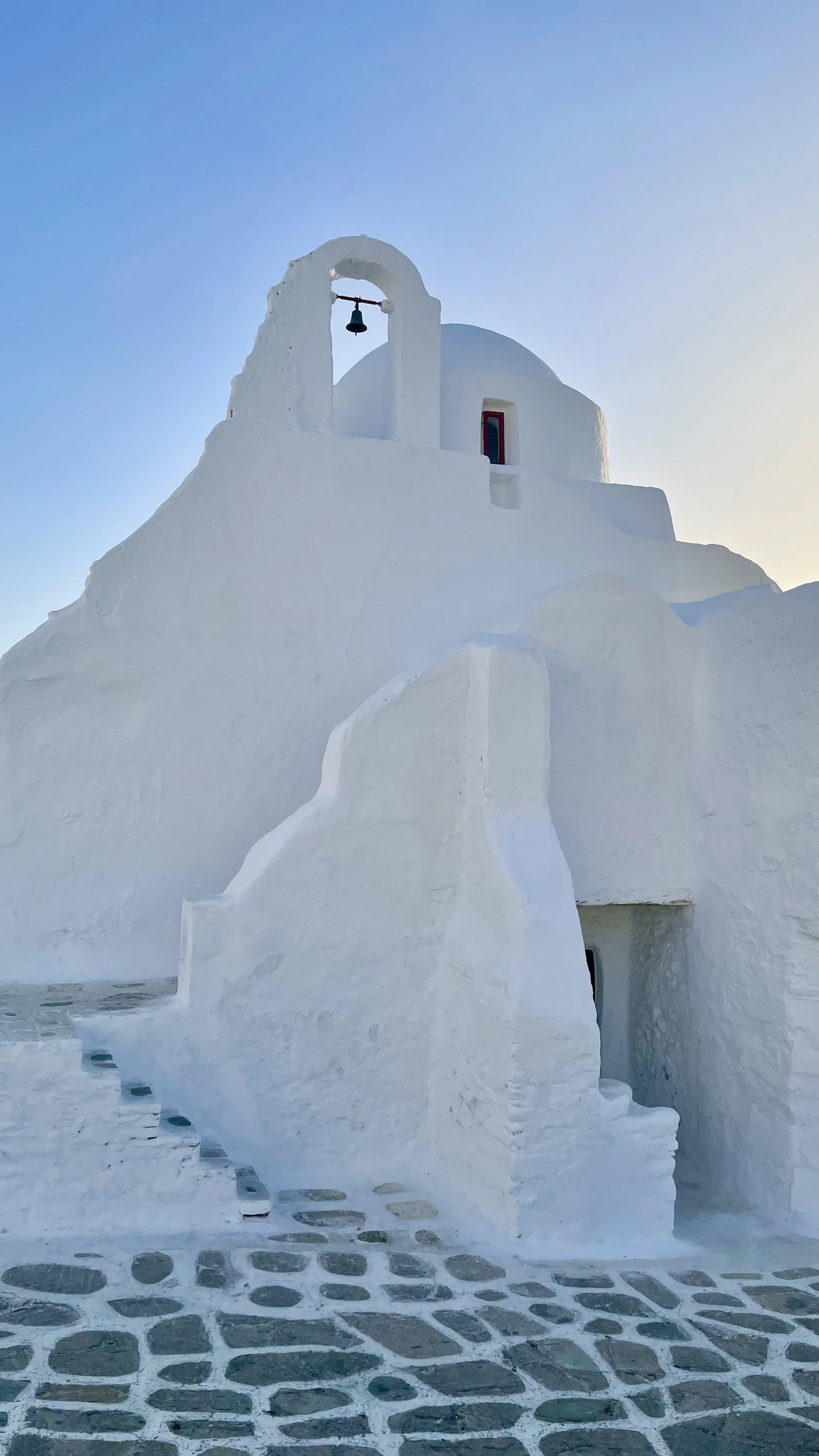 white concrete building near body of water during daytime