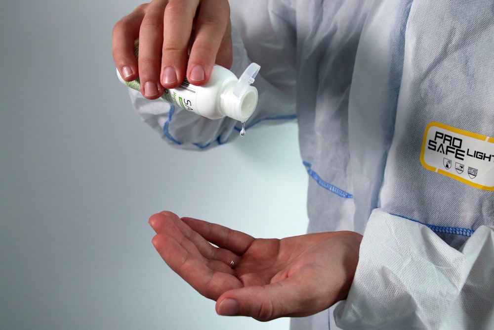 person holding white ceramic mug