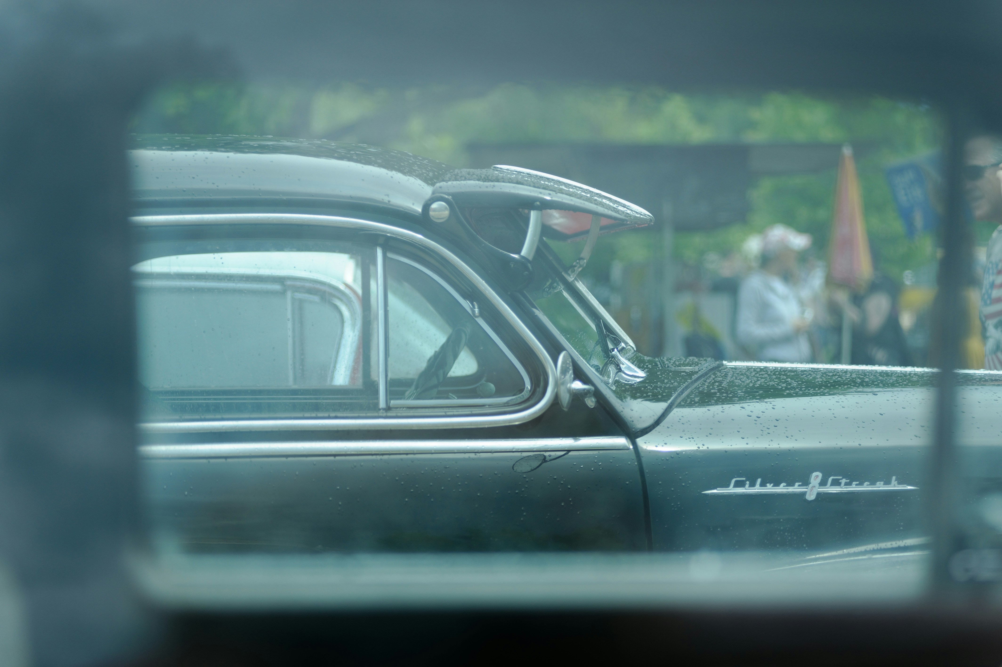 a reflection of a car in a rear view mirror