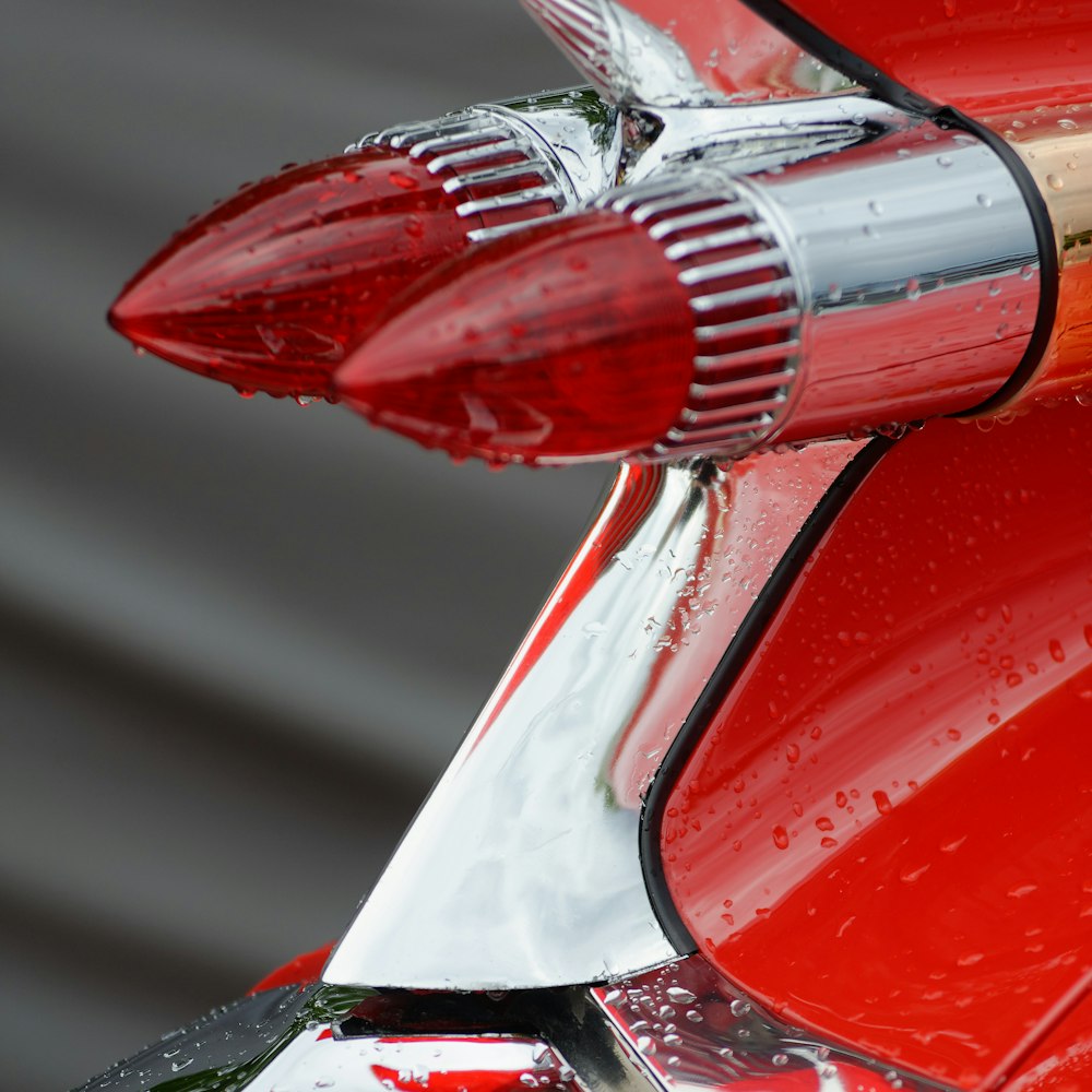 red car side mirror during daytime