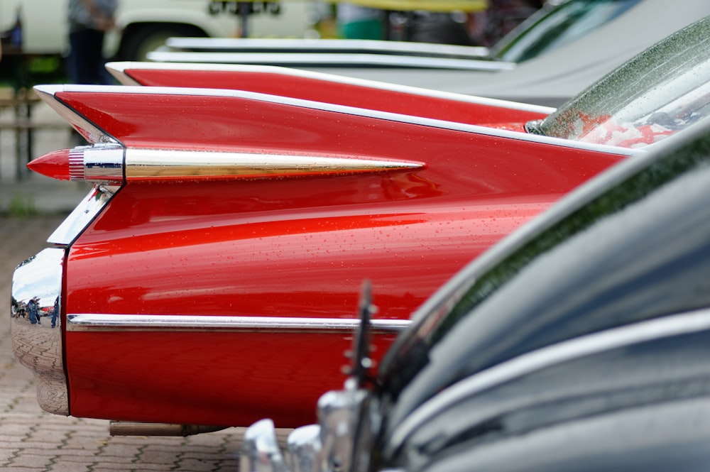 red car in front of white car