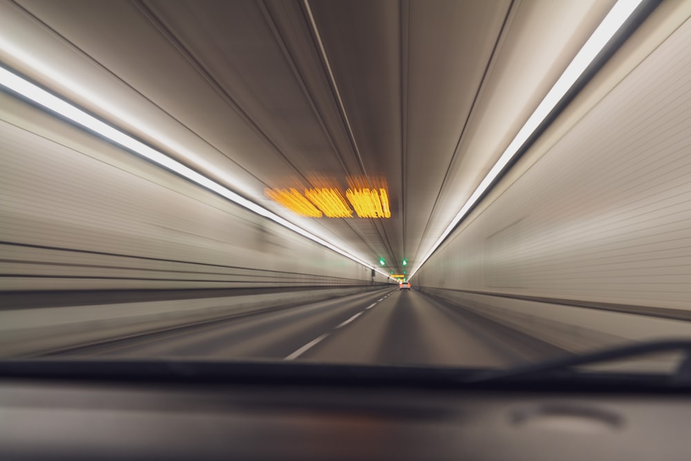 white and black tunnel with yellow lights