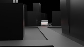 A minimalist, dark urban scene with tall, featureless black buildings surrounding a central, small, white vehicle. The ground is flat and gray, contributing to the stark, almost abstract feel of the environment.