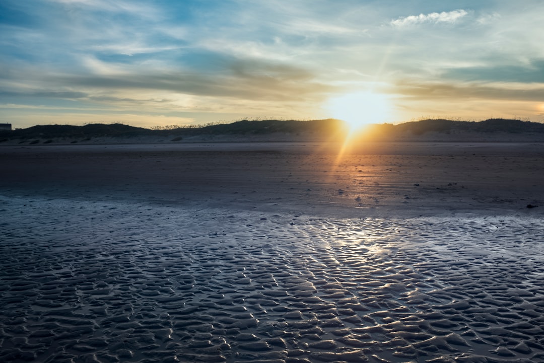 body of water during sunset