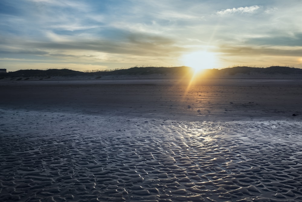 body of water during sunset