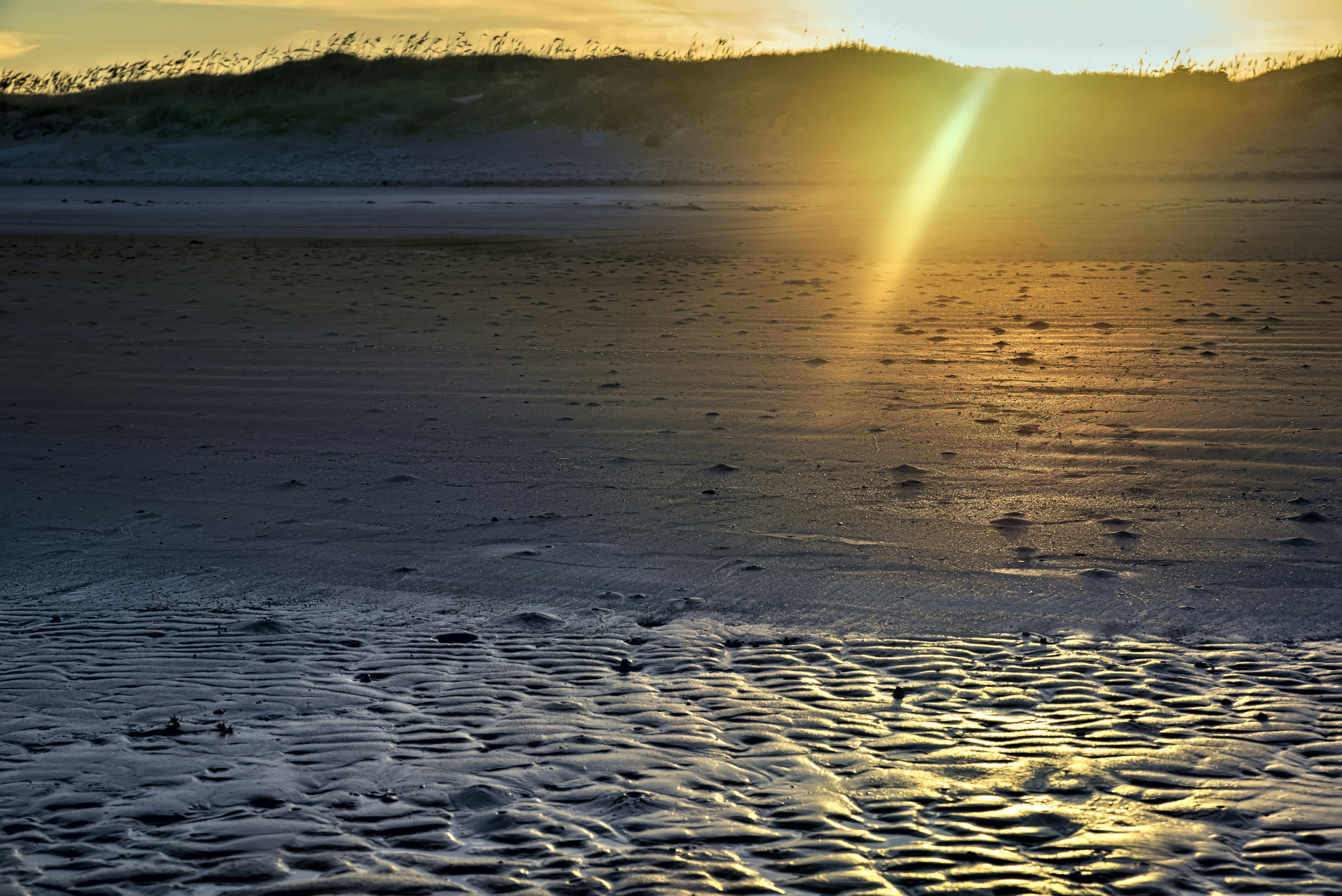 Brown sand near body of water during daytime photo Free Corpus
